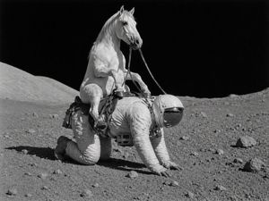 A photoreal black-and-white surreal scene of a horse riding an astronaut...