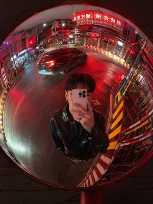 This prompt generates a cinematic realistic fisheye selfie in a roadside...