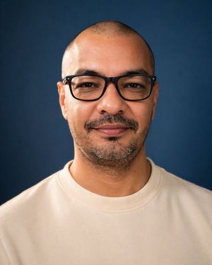 This prompt generates a realistic studio head-and-shoulders portrait of...