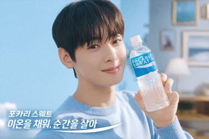 Generates a bright, commercial-style portrait of a model holding a bever...